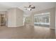Expansive living room with hardwood floors, ceiling fan, and sliding doors to the pool at 621 Erin Way, Brooksville, FL 34601