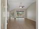 Bright living room with hardwood floors and sliding glass doors to the pool area at 621 Erin Way, Brooksville, FL 34601