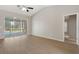 Open-concept living room with ample natural light and access to outdoor living space at 621 Erin Way, Brooksville, FL 34601