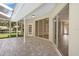 Covered patio features brick pavers and seamless access to the home's interior at 621 Erin Way, Brooksville, FL 34601