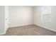 Cozy carpeted bedroom with ample natural light from the window and a neutral color palette at 2587 Garden Plum Pl, Odessa, FL 33556