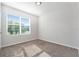 A bright bedroom featuring neutral carpet and lots of natural light at 2587 Garden Plum Pl, Odessa, FL 33556