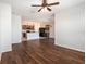 Open-concept living room with tile floors, seamlessly connecting to the kitchen and dining areas for modern living at 2587 Garden Plum Pl, Odessa, FL 33556