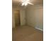 Comfortable bedroom featuring carpet, closet access, natural light, and ceiling fan at 4152 66Th Street W Cir # 4152, Bradenton, FL 34209