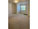 Bright bedroom with neutral carpeting and a large window allowing ample natural light at 4152 66Th Street W Cir # 4152, Bradenton, FL 34209