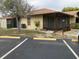 Cozy single-story home featuring a screened-in porch, complemented by an asphalt driveway and neat landscaping at 4152 66Th Street W Cir # 4152, Bradenton, FL 34209