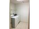 Practical laundry room with a washer and dryer set, and tiled flooring for easy maintenance at 4152 66Th Street W Cir # 4152, Bradenton, FL 34209
