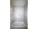 Nicely tiled shower and tub with a built-in niche for storage at 8990 Glenarm Way, Weeki Wachee, FL 34613