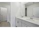 Bright bathroom with double sink vanity, tiled flooring, and a walk in shower at 14118 Crutchfield Ct, Parrish, FL 34219