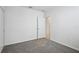 Bedroom featuring neutral carpet, ample closet space and bright white walls at 14118 Crutchfield Ct, Parrish, FL 34219