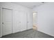 Bedroom showcasing neutral walls, plush carpet, and closet with double doors at 14118 Crutchfield Ct, Parrish, FL 34219