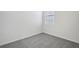 Bright bedroom features plush carpeting and a sun-filled window at 14118 Crutchfield Ct, Parrish, FL 34219