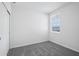 Bedroom featuring a window with blinds and a neutral colored carpet at 14118 Crutchfield Ct, Parrish, FL 34219
