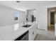Modern kitchen featuring a large island with stainless steel sink and faucet, and stainless appliances at 14118 Crutchfield Ct, Parrish, FL 34219