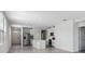 Open concept living room and kitchen area with new flooring and stainless steel appliances at 14118 Crutchfield Ct, Parrish, FL 34219