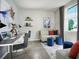 Functional home office with dual workstations, comfortable seating, and a bright window at 193 Lazy Shore Dr, Nokomis, FL 34275