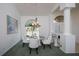 Bright dining room with ample natural light, a modern table, and elegant decor at 470 Bermuda Isles Cir, Venice, FL 34292