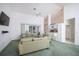 Bright living room with high ceilings, ceiling fan, and sliding glass doors to outdoor space at 470 Bermuda Isles Cir, Venice, FL 34292