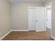 Bedroom featuring wood-look flooring, closet, and neutral paint at 912 Magnolia Dr, Clearwater, FL 33756