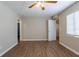 This bedroom features hardwood floors and fresh paint and an open doorway for an airy feel at 912 Magnolia Dr, Clearwater, FL 33756