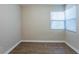Cozy bedroom with wood-look flooring and a bright window at 912 Magnolia Dr, Clearwater, FL 33756