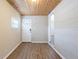 The entryway features hardwood floors, a custom wood ceiling, and fresh paint at 912 Magnolia Dr, Clearwater, FL 33756