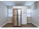 Clean kitchen featuring stainless steel refrigerator and ample cabinet space at 912 Magnolia Dr, Clearwater, FL 33756