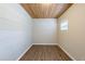 A bonus room with custom wood ceiling, fresh paint, and hardwood floors at 912 Magnolia Dr, Clearwater, FL 33756