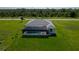 Aerial view of a new home with a screened pool and large yard at 193 Rotonda S Blvd, Rotonda West, FL 33947