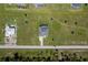 Overhead view of a house with a pool and large yard in a rural area at 193 Rotonda S Blvd, Rotonda West, FL 33947