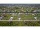 Drone shot showcasing a home in a sprawling neighborhood near canals and waterways at 193 Rotonda S Blvd, Rotonda West, FL 33947