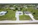 A view of a neighborhood featuring neatly landscaped homes and green lawns in Florida at 209 Rotonda S Blvd, Rotonda West, FL 33947