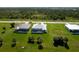 Aerial view of homes with pools, separated by empty lots with palm trees in Florida at 209 Rotonda S Blvd, Rotonda West, FL 33947