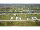 Aerial view of a large residential area featuring canals, wetlands, and scattered single-Gathering homes at 211 Rotonda S Blvd, Rotonda West, FL 33947