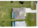 Aerial view of a single Gathering home that includes a screened-in pool and well-maintained lawn at 211 Rotonda S Blvd, Rotonda West, FL 33947