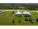 Aerial view of two single Gathering homes with screened-in pools and spacious backyards at 211 Rotonda S Blvd, Rotonda West, FL 33947
