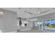Open-concept kitchen featuring sleek white cabinetry and modern stainless-steel appliances at 211 Rotonda S Blvd, Rotonda West, FL 33947