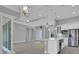Spacious living room with high ceilings, pendant lighting, and an open floor plan concept at 211 Rotonda S Blvd, Rotonda West, FL 33947