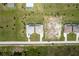 Aerial shot of residential neighborhood with houses, driveways, and lush green lawns on spacious lots at 235 Rotonda S Blvd, Rotonda West, FL 33947