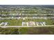 Scenic aerial view of a sprawling residential area featuring homes, canals, and well-maintained landscaping at 235 Rotonda S Blvd, Rotonda West, FL 33947