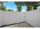 Fenced backyard patio area with white vinyl fence and green trees at 5112 Temple Heights Rd # B, Tampa, FL 33617