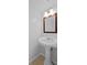 Bathroom featuring a white pedestal sink and tiled floors at 5112 Temple Heights Rd # B, Tampa, FL 33617