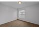 Bedroom featuring wood-look laminate flooring and a large window at 5112 Temple Heights Rd # B, Tampa, FL 33617