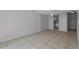 Open-concept living room features tile flooring and access to the kitchen at 5112 Temple Heights Rd # B, Tampa, FL 33617