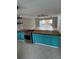 Spacious kitchen with an island, stainless steel oven, and ample counter space, perfect for cooking and entertaining at 431 David Ct, Palm Harbor, FL 34684