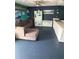 Inviting living room featuring comfortable seating, storage, and stylish decor at 431 David Ct, Palm Harbor, FL 34684