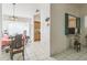 Cozy dining area with tile flooring, chandelier and convenient pass-through to the kitchen at 26098 Copiapo Cir, Punta Gorda, FL 33983