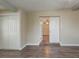 Basement area featuring wood-look flooring, closet, and doorway to other spaces at 4906 S 87Th St, Tampa, FL 33619