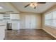 Inviting living room with hardwood floors, natural light, and access to the kitchen at 4906 S 87Th St, Tampa, FL 33619