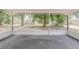 Spacious screened porch offers serene views of the surrounding trees and a private outdoor space at 4906 S 87Th St, Tampa, FL 33619